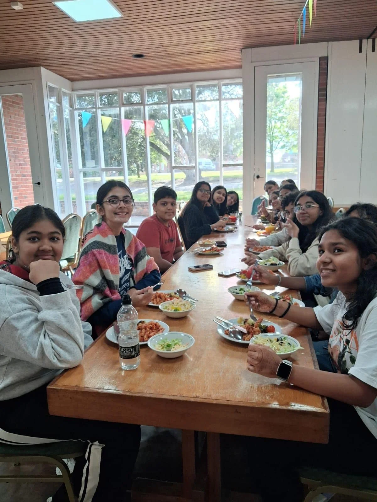 GoldenBee students sharing a meal together during the UK immersion programme