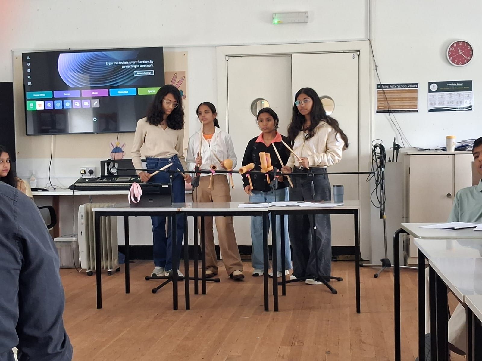 GoldenBee students performing at a music session during the UK immersion programme
