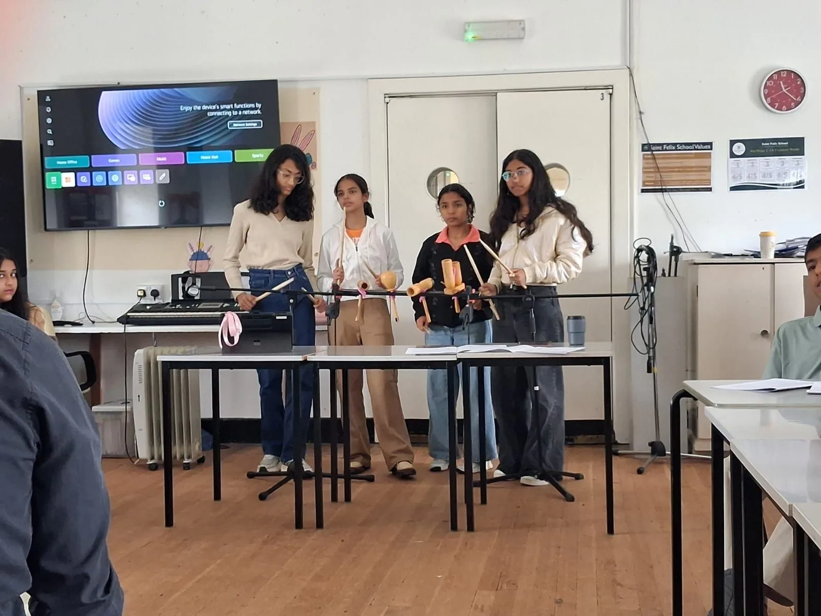 GoldenBee students performing at a music session during the UK immersion programme