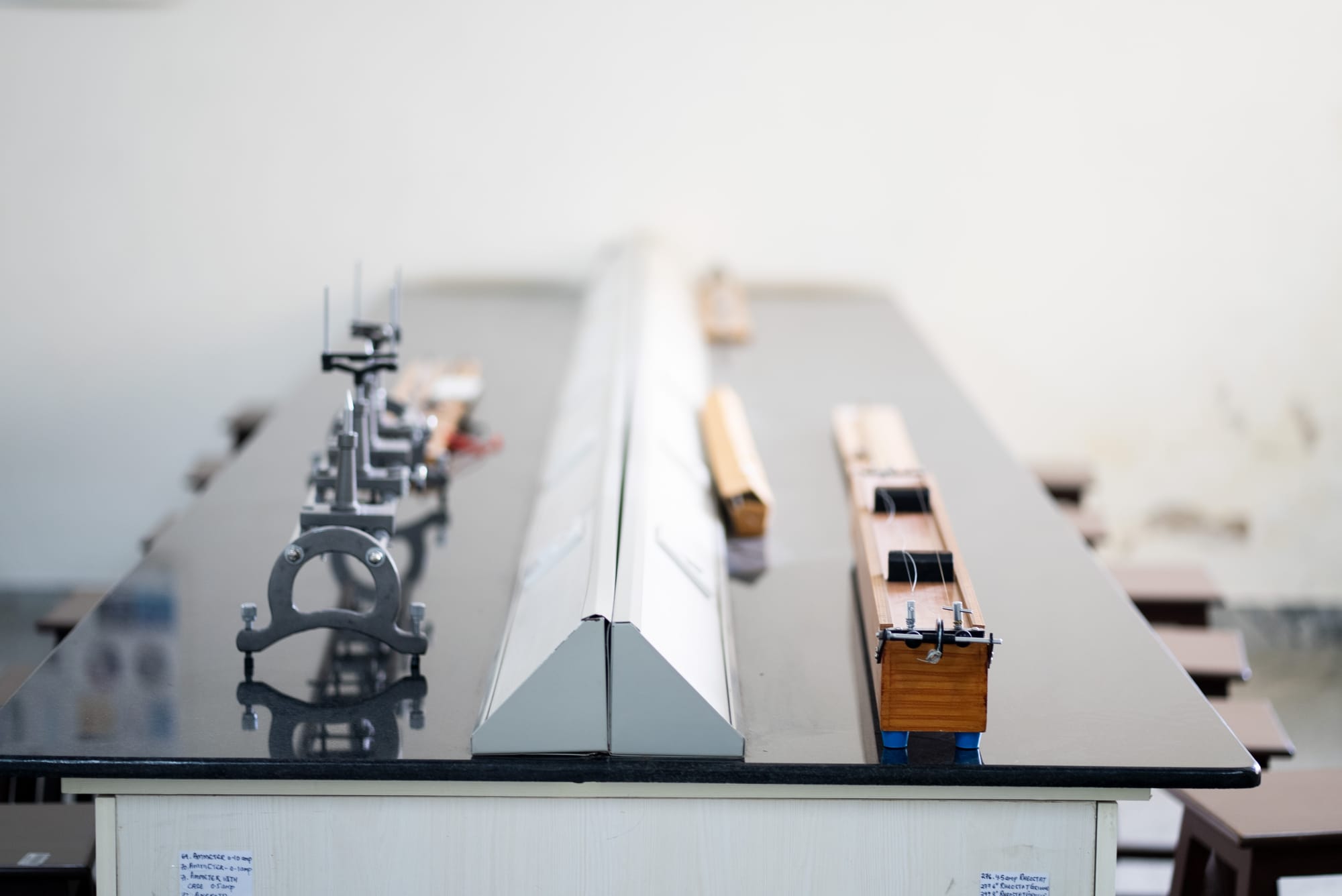 Physics experiment apparatus arranged on a lab bench at GoldenBee Global School