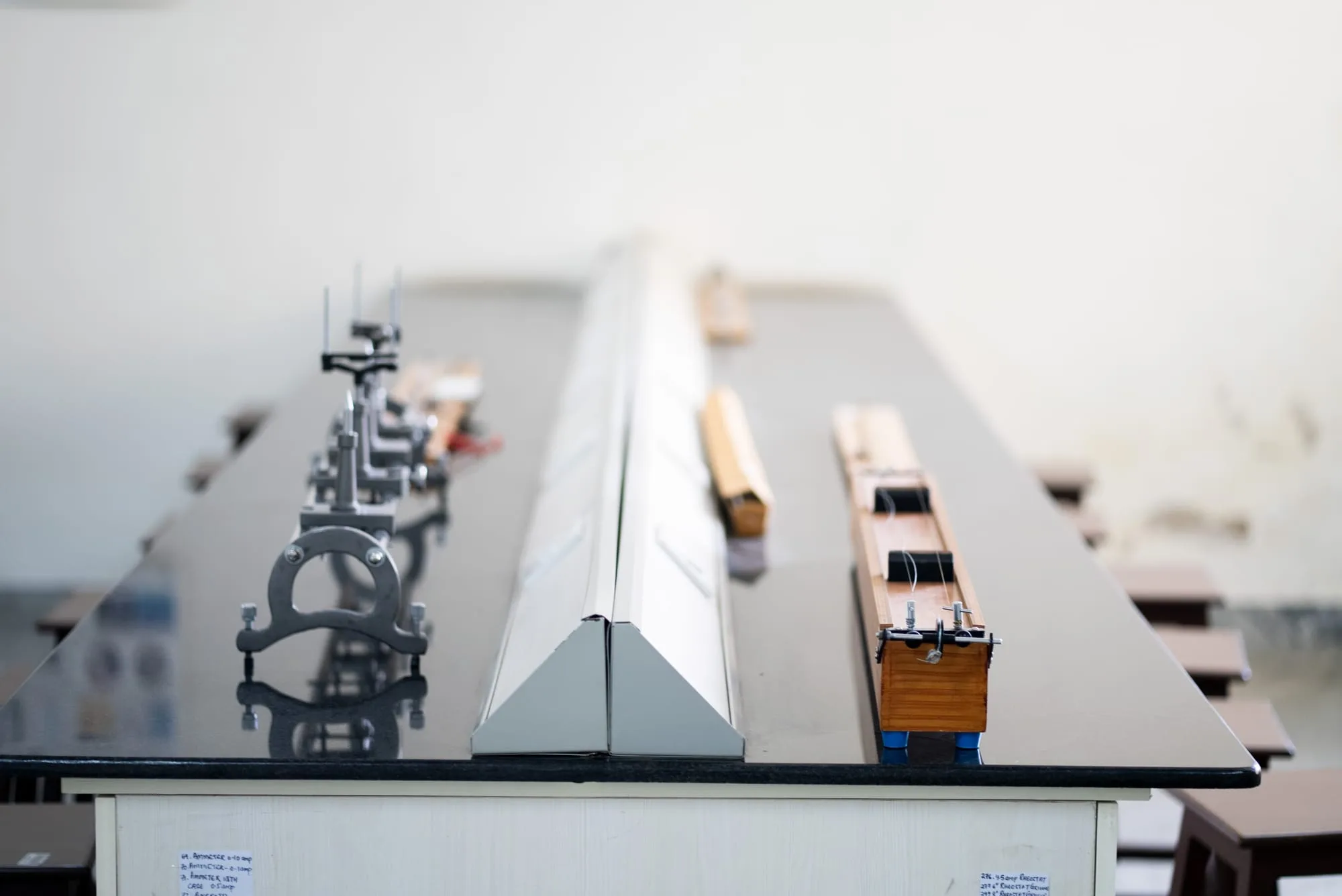 Physics experiment apparatus arranged on a lab bench at GoldenBee Global School